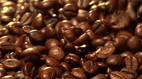 Coffee beans fall. Slow motion. Stockbeeldmateriaal 55903905