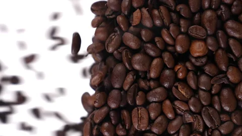 Coffee beans fall in slow motion and cover the whole screen, vertical video Stock Footage 167302166