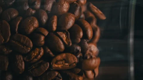 Coffee Beans Fall in Slow Motion and Cover the Entire Screen Stock Footage 263227906