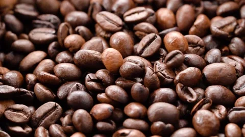Coffee beans fall slowly on a pile of coffee beans 库存影片 159789229