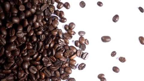 Coffee Beans Falling against White Background from side left to right, Slow Stock Footage 84148608