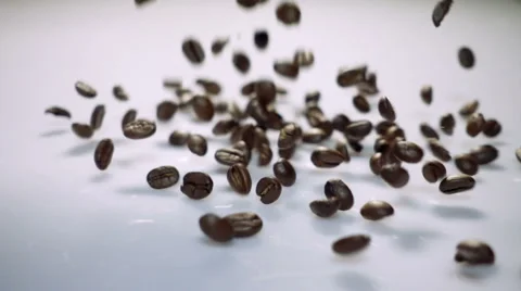 Coffee beans falling and bouncing in slow motion Stock Footage 54586569