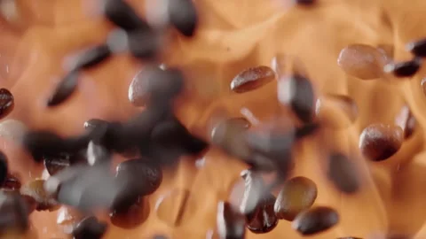 Coffee Beans Falling And Fire Blazes Behind It Stock Footage 254998009