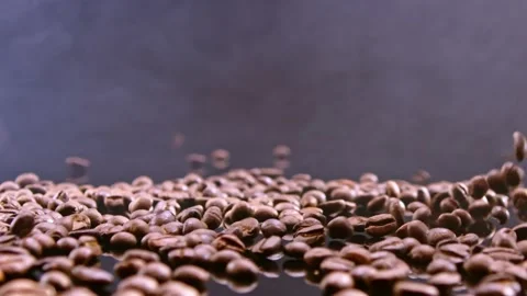 Coffee beans falling on a black mirror Stock Footage 195107449