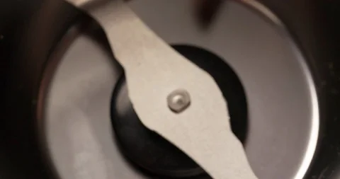 Coffee beans falling into coffee grinder close up top view Slow Motion Stock Footage 98244902