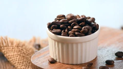 Coffee beans falling in to a cup. Stock Footage 131451274