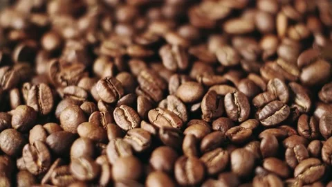 Coffee beans falling down. Fragrant, fresh roasted coffee. Stock Footage 140188818