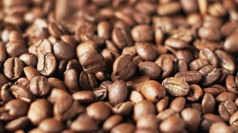 Coffee beans falling down, slow motion. Fragrant, fresh roasted coffee. Stock Footage 139615802