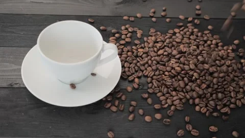 Coffee Beans falling down on a table Stock Footage 255860906