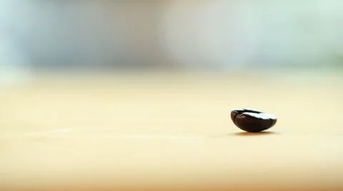Coffee Beans falling down on wood floor Stock Footage 51414176