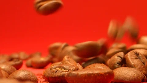 Coffee Beans Falling in Extreme Slow Motion with Red Background Video stock 126843989