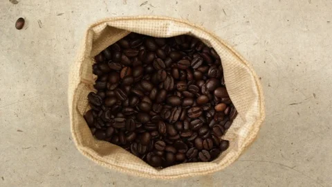 Coffee beans falling from hands Stock Footage 105552685