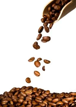 Coffee beans falling on heap of coffee, isolated on white Stock Photos