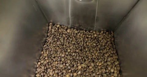 Coffee Beans is falling out In A Manufactory Workshop Stock Footage 77375928