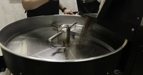 Coffee Beans is falling out In A Manufactory Workshop Stock Footage 77376289