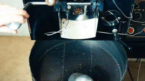 Coffee Beans Falling Out of Roaster Stock Footage 123729716