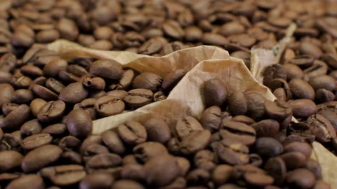 Coffee Beans Falling On Rotating Plate Stock Footage 146828010