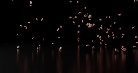Coffee beans falling onto a shiny surface in slow motion and bouncing off Stock Footage 245807554