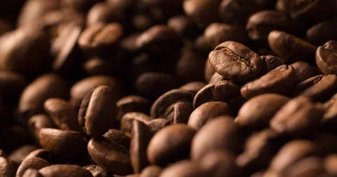 Coffee Beans Falling Slow Motion on blurred background macro shot Stock Footage 98239564