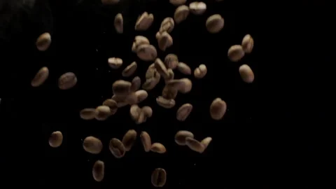 A Coffee Beans Falling in Slow Motion Isolated on Black Background Stock Footage 146828196