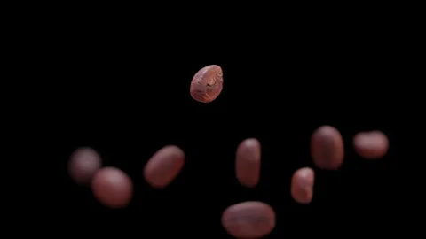 Coffee beans falling in slow motion. Cinematic close-up. Stock Footage 239648321