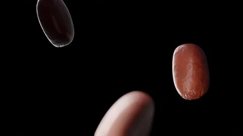 Coffee beans falling in slow motion. Cinematic close-up. Stock Footage 239650663