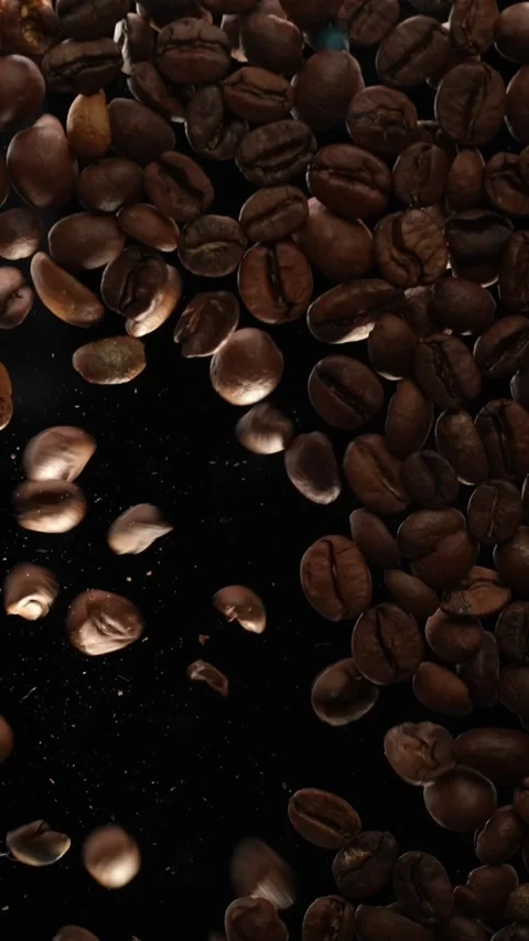 Coffee beans falling in slow motion Stock Footage 265749514