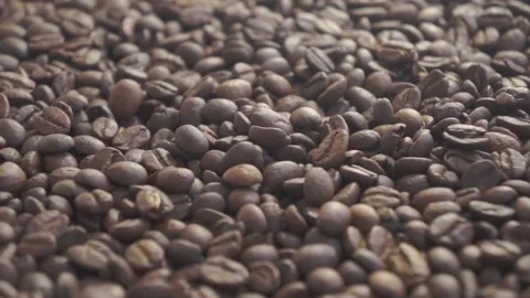 Coffee beans falling slowly  in low light Stock-Footage 151165535