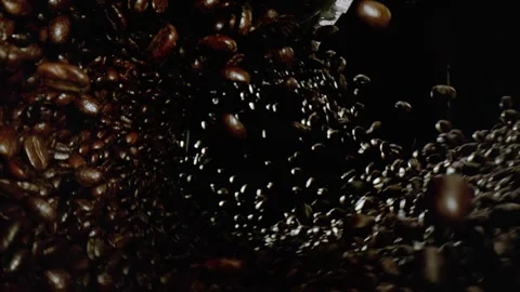 Coffee Beans Falling In A Swirling Pattern Against Darkness Stock Footage 254997840
