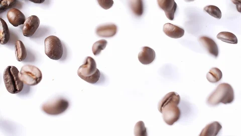 Coffee Beans falling onto White Background 1 Video stock 99124458
