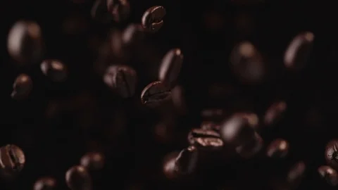 Coffee beans fly after being exploded. Slow Motion. Stock-Footage 76228165