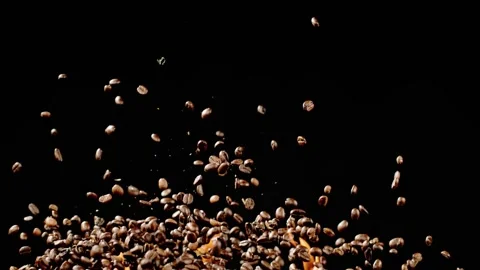 Coffee Beans Fly Through The Air In Front Of Flames Stock Footage 254998037