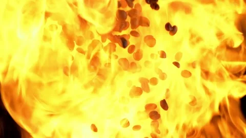 Coffee beans flying up on black background with fire Vidéo 130965697