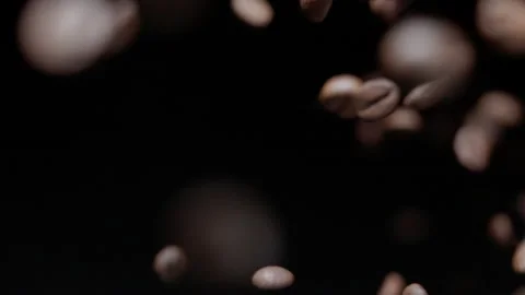 Coffee beans flying in slow motion Stock Footage 259084697
