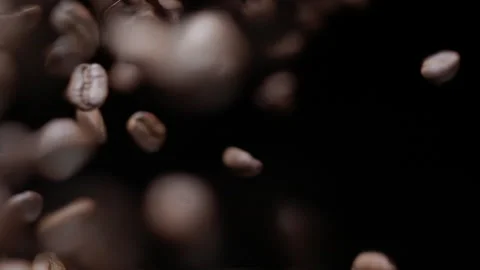 Coffee beans flying in slow motion Stock Footage 259084714