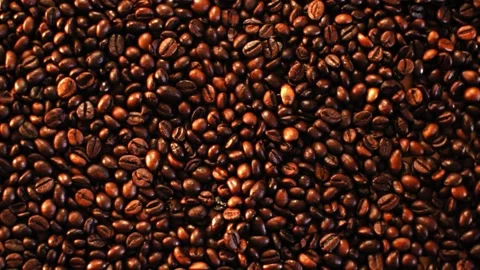 Coffee beans in the foreground Stock Footage 148386729