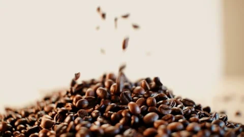 Coffee beans in the foreground Stock Footage 148386762