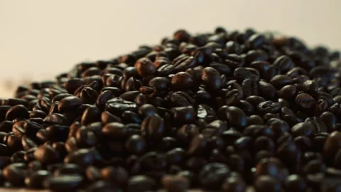 Coffee beans in the foreground Stock Footage 148386777