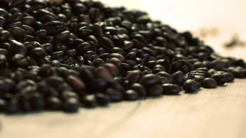 Coffee beans in the foreground Stock Footage 148386799