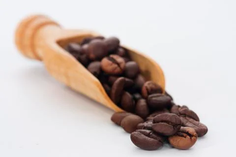 Coffee beans in the foreground Stock Photos