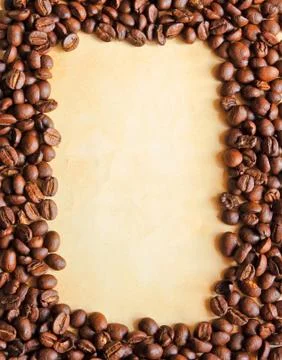 Coffee beans as frame with old paper background for notes Stock-Fotos