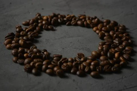 Coffee beans on a grey surface Stock Photos