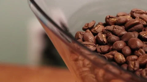 Coffee Beans in a Grinder Hopper while Grinding - Pan Stock Footage 61404252