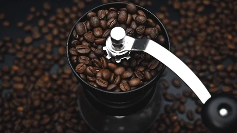 Coffee beans in grinder slow motion Stock Footage 121352378