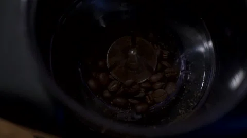 Coffee beans grinding slow motion Stock Footage 146947548