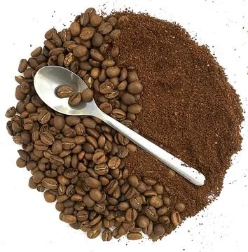 Coffee beans, ground coffee and a spoon. Stock Photos