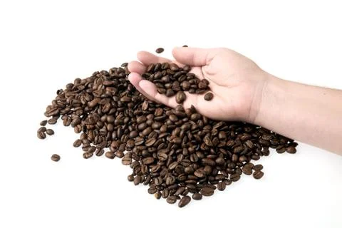Coffee beans in hand Stock Photos