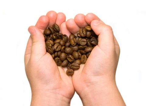 Coffee beans in hands Stock Photos