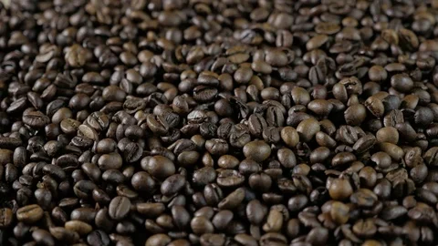 Coffee beans. Hands scattered coffee beans. Women's hands touch coffee beans. 4k Stock Footage 78157169