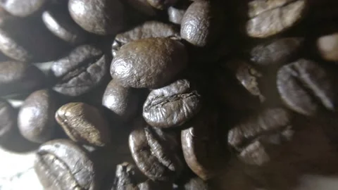 Coffee beans that have been fried and ready to be mashed to make coffee drinks Stock Footage 227092677